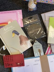 A selection of gift items lying on the floor to see a sample of what can be in a charity gift bag