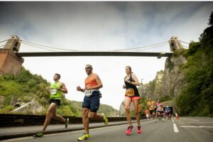 Runners under Clifton Suspension Bridge