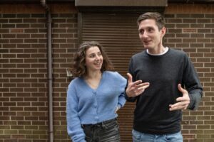 Smiling adults in conversation