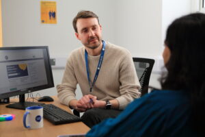 Adviser talking to woman