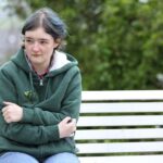 Serious younger woman_394A3995 small Serious woman sat on bench