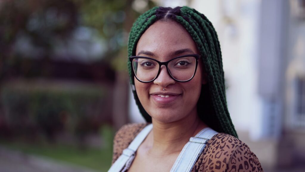 Portrait,Of,A,Smiling,Brazilian,Young,Black,Woman,With,Braided