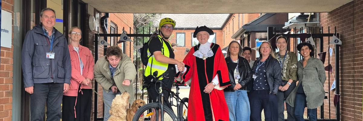WIX banner photo 3x1 (29) Cyclist Ed with the charity's team and Yate's Mayor