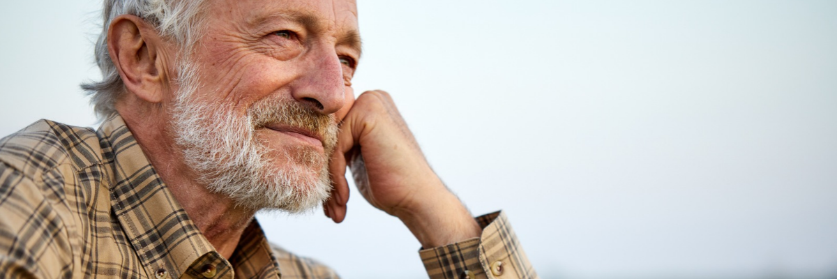 WIX banner photo 3x1 (9) Smiling man looking into distance